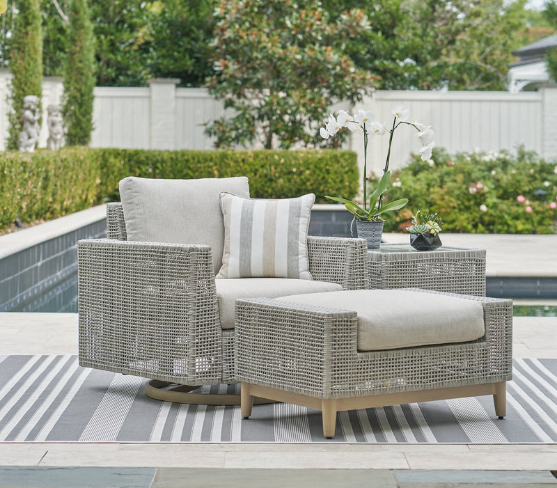 Seton Creek outdoor seating set by Ashley Furniture with cushioned chairs and a matching table, designed for patio relaxation.