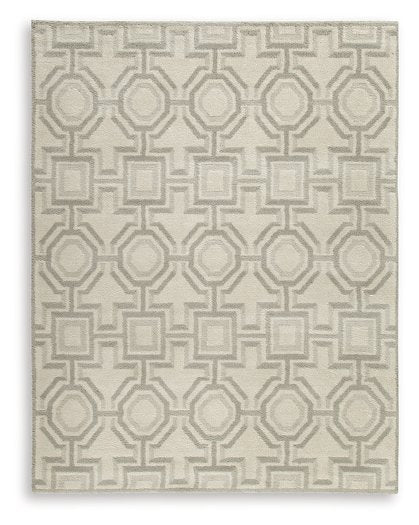 Large Maconville rug by Ashley Furniture with intricate pattern in warm tones, suitable for living room or bedroom decor.
