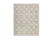 Large Maconville Rug by Ashley Furniture showcasing a plush, patterned area rug with intricate details and warm tones.