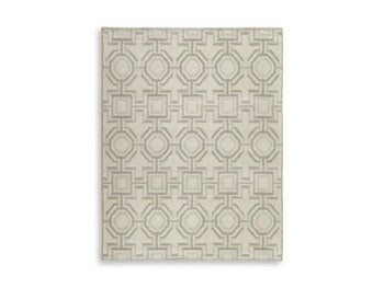 Large Maconville Rug by Ashley Furniture showcasing a plush, patterned area rug with intricate details and warm tones.