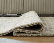 Large Maconville rug by Ashley Furniture, detailed view showing intricate pattern and plush texture on a neutral background.