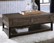Ashley Furniture Johurst occasional table set featuring modern coffee and side tables with sleek wood finishes.