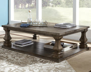 Ashley Furniture Johnelle Occasional Table Set with three matching tables featuring sleek wood finishes and modern design.