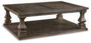Ashley Furniture Johnelle Occasional Table Set with two elegant side tables featuring sleek wooden surfaces and modern design.