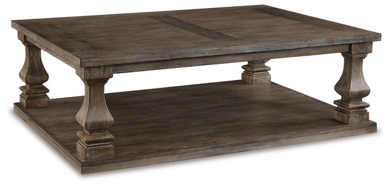 Ashley Furniture Johnelle Occasional Table Set with two elegant side tables featuring sleek wooden surfaces and modern design.