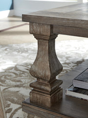 Ashley Furniture Johnelle occasional table set with two elegant wooden tables featuring sleek tabletops and sturdy legs.