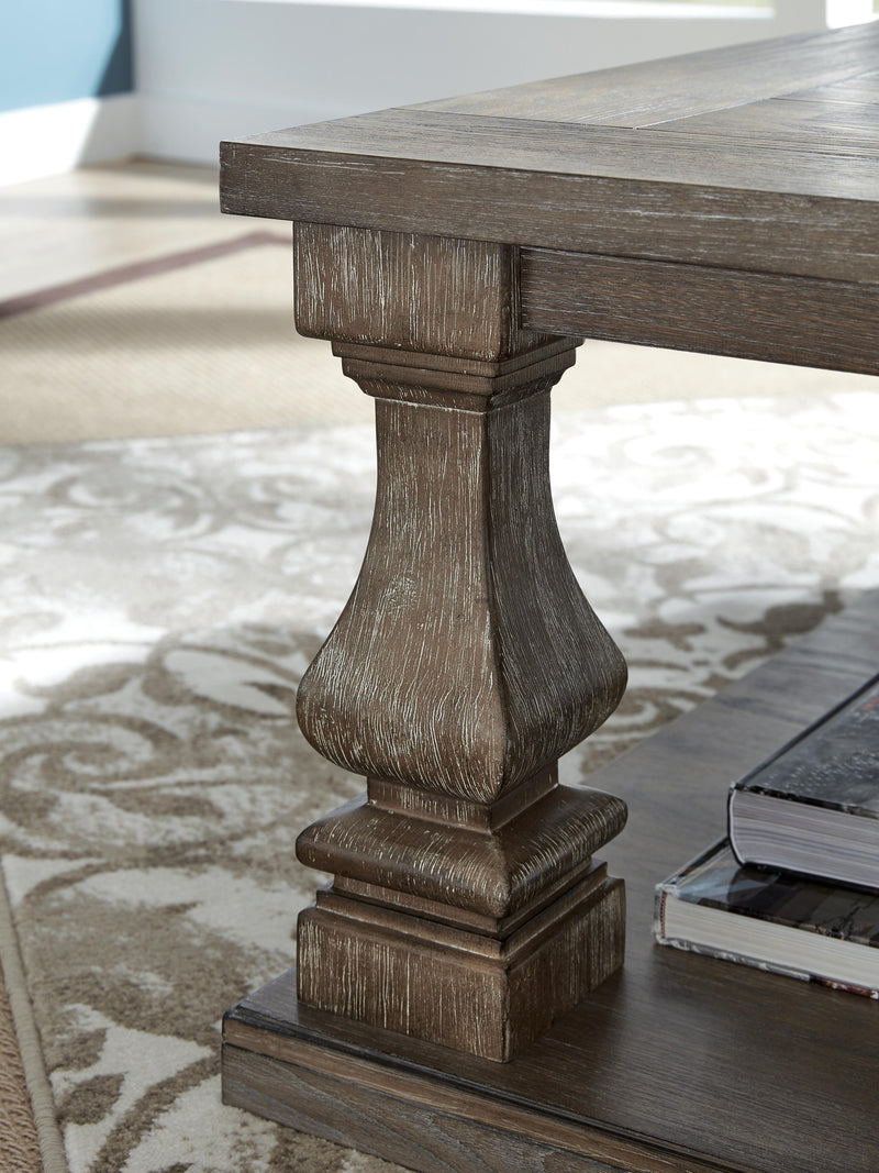Ashley Furniture Johnelle occasional table set with two elegant wooden tables featuring sleek tabletops and sturdy legs.