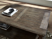 Ashley Furniture Johnelle Occasional Table Set featuring round tables with wood tops and sleek metal legs.