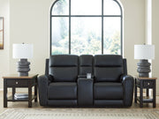 Ashley Furniture 5Z-Comfort Power Reclining Loveseat with console, showing plush fabric, built-in cup holders, and reclined seating.