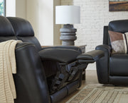 Ashley Furniture 5Z-Comfort Power Reclining Loveseat with console, featuring plush upholstery and built-in cup holders.