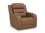 Ashley Furniture Knightington power recliner with audio seating, shown closed from an angle, featuring plush upholstery and built-in audio speakers.