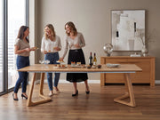 Transformer Table Nova dining table in a modern wood finish, shown with expandable table design
