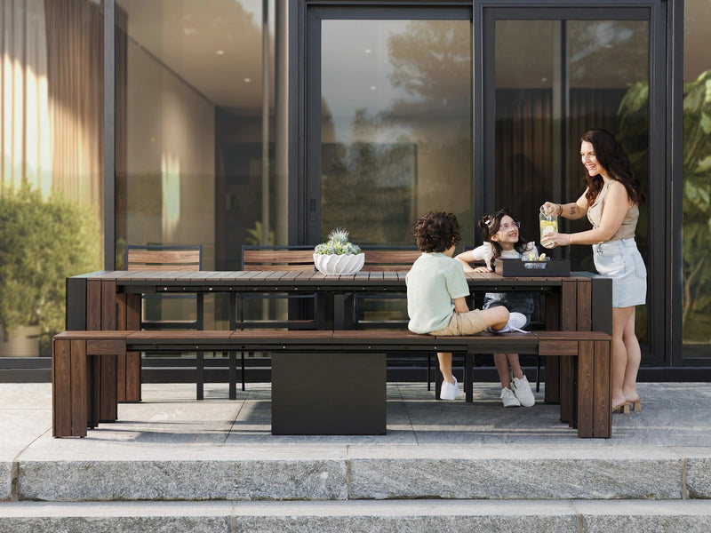 Transformer Table outdoor dining set with expandable table and matching chairs on a patio