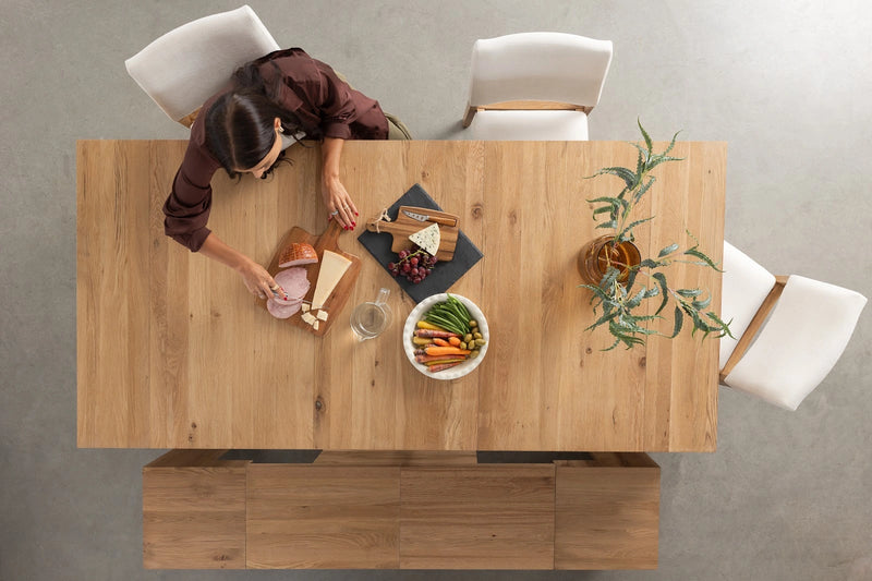 Transformer Table expandable dining table in a modern wood finish, shown configured for dining seating.