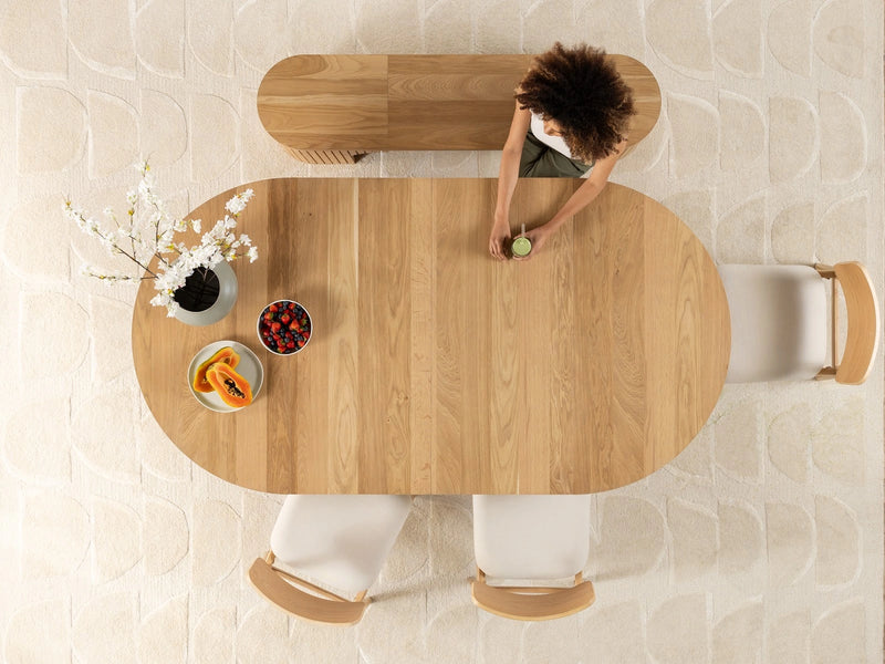 Transformer Table round dining table with a sleek tabletop and sturdy central pedestal base