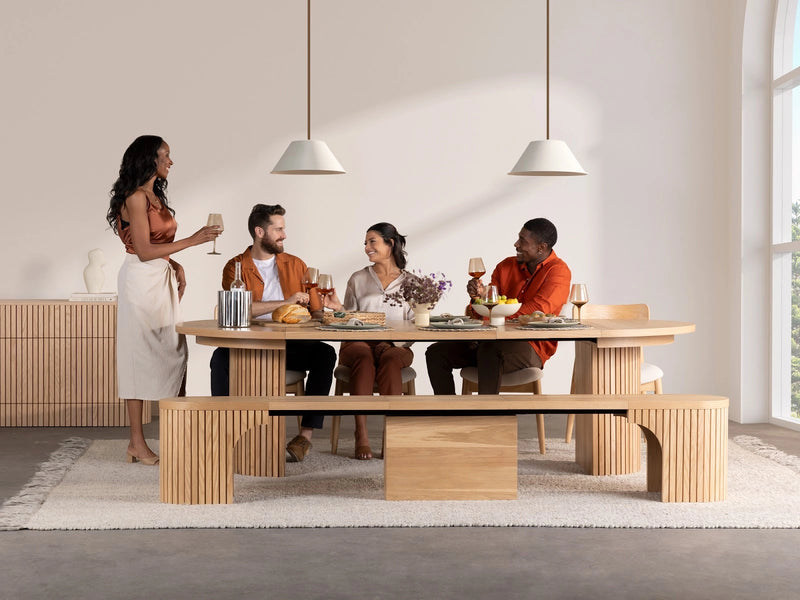 Transformer Table round dining set with expandable round table and matching chairs in a modern dining room