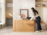 Transformer Table round sideboard buffet in a modern wood finish with curved doors and storage space