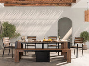 Transformer Table outdoor dining set with expandable table and matching chairs in an outdoor setting