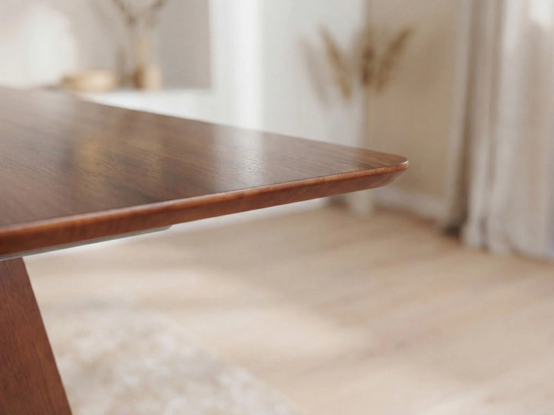 Transformer Table Nova dining table in natural wood finish, shown fully extended for seating multiple guests