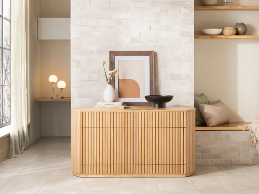 Transformer Table round sideboard buffet in a modern design, shown closed with a smooth tabletop and storage base