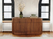 Transformer Table round sideboard buffet in a modern design, shown closed with a smooth wood finish