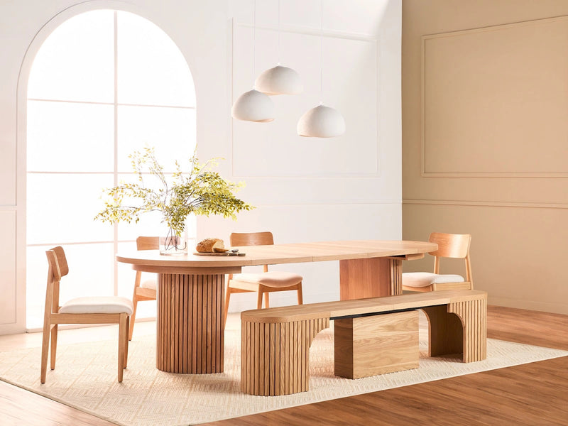Transformer Table round dining set with round table and matching dining chairs in a modern interior
