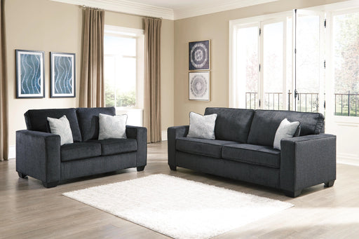 Ashley Furniture Altari living room set with sofa and armchair, featuring plush cushions and modern design, in a cozy living space.